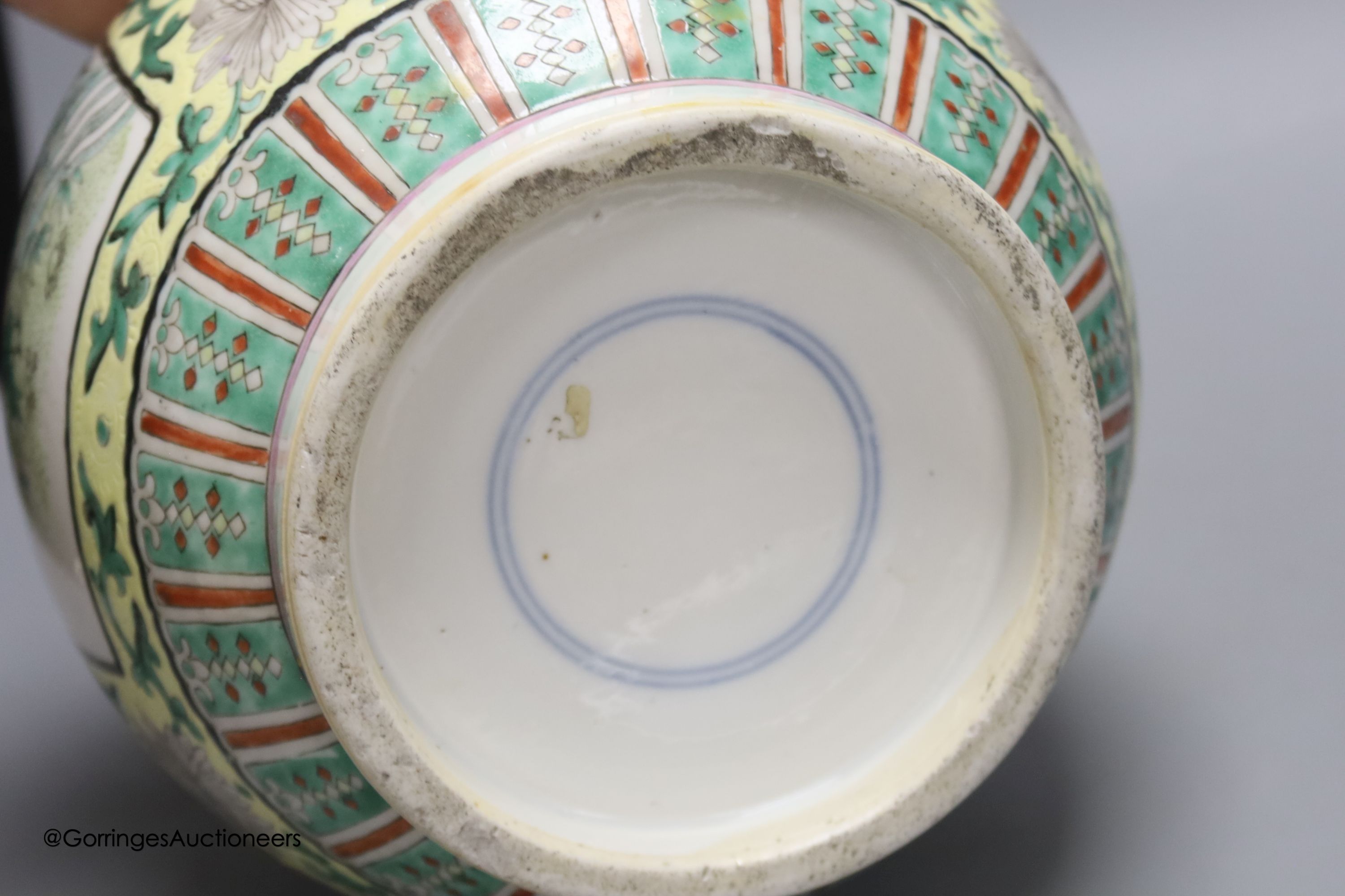 A large 19th century Chinese famille verte yellow ground bottle vase, height 47cm, restorations